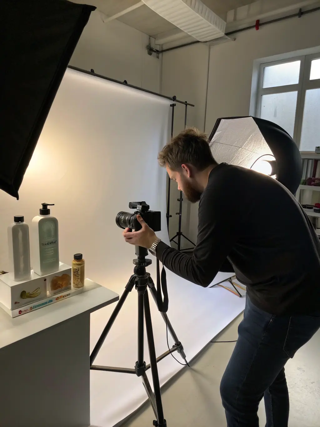 A photographer adjusting lighting equipment in a studio setting, preparing for a product photography session, showcasing Sanerna's expertise in creating visually appealing images.